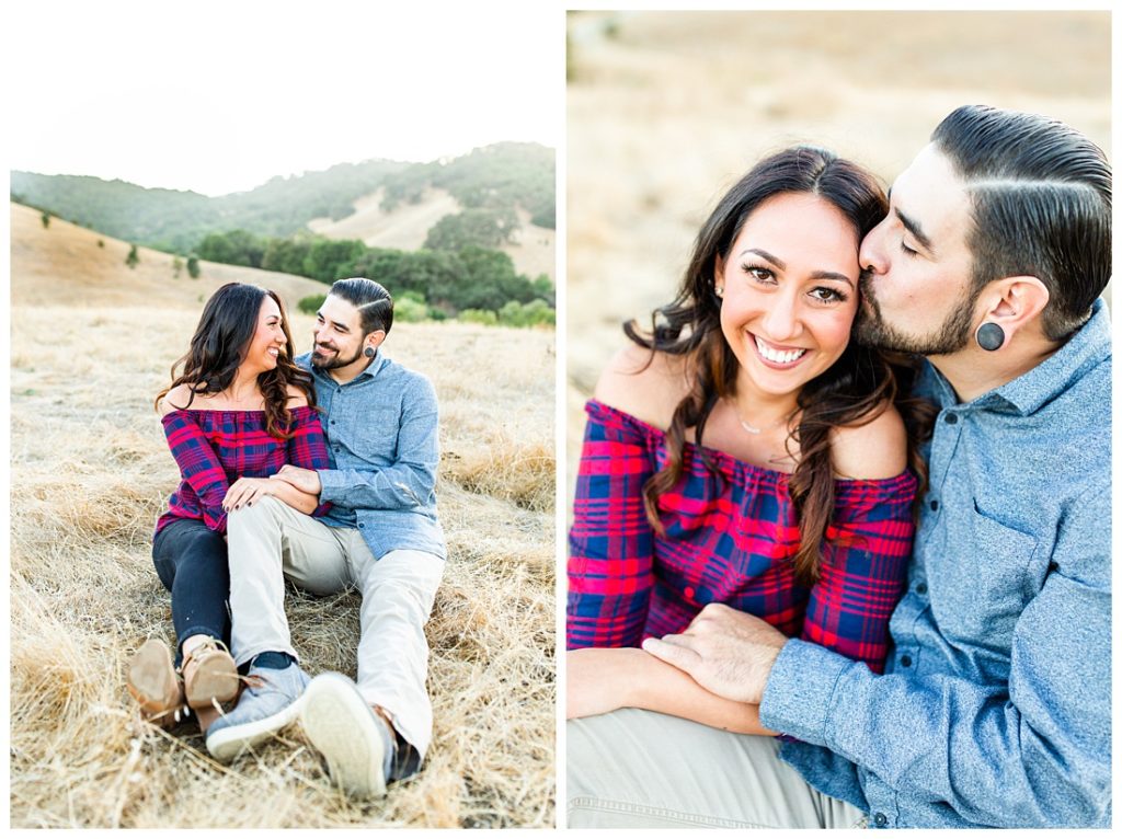 couple sitting and cuddling at engagement session