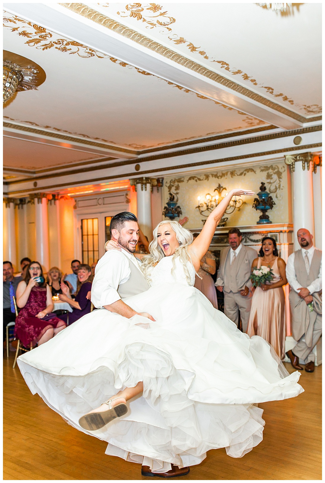 groom spinning bride during first danc
