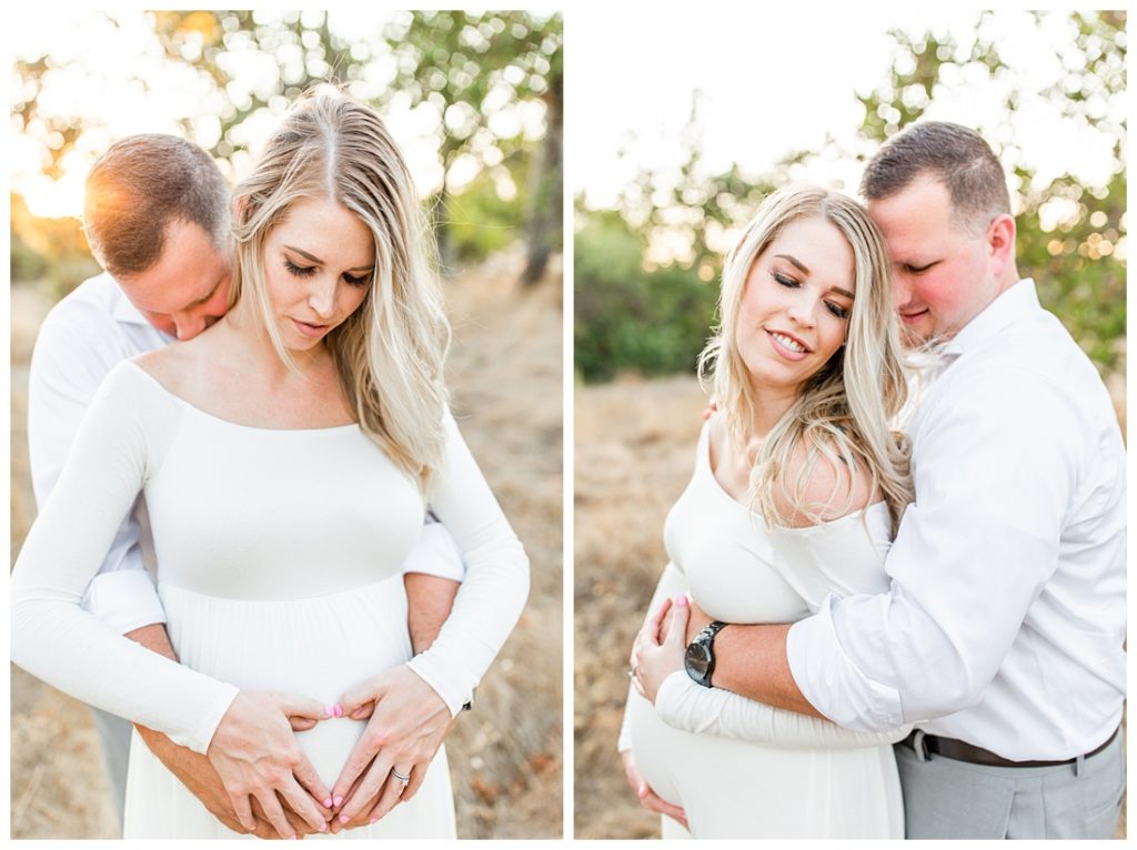 dad hugging mom and holding bump at maternity session