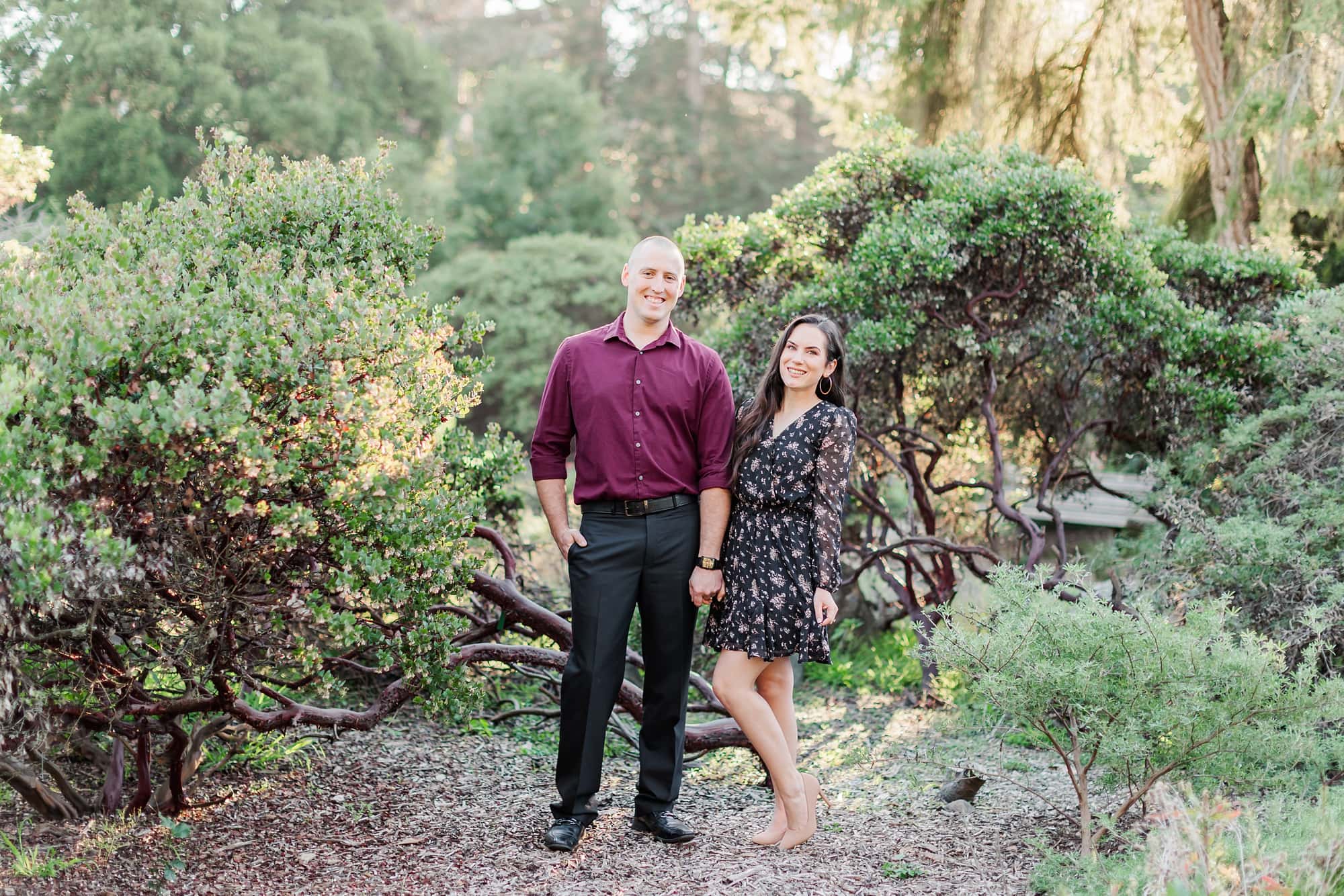 couple standing side by side pose at engagement session