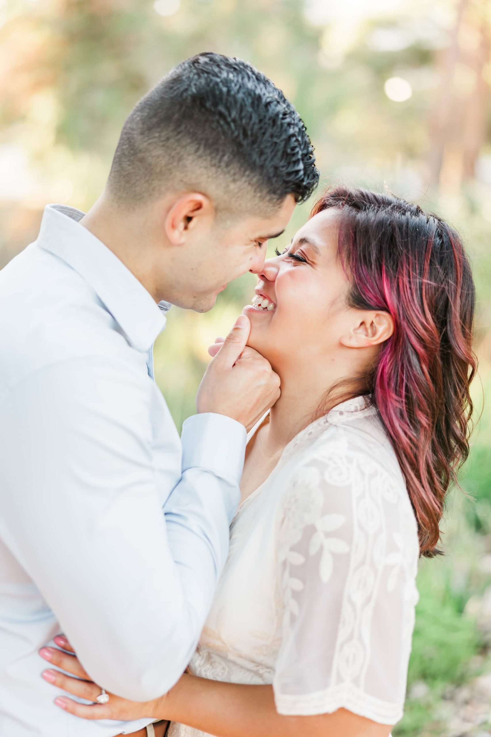 happy almost kiss face at engagement session