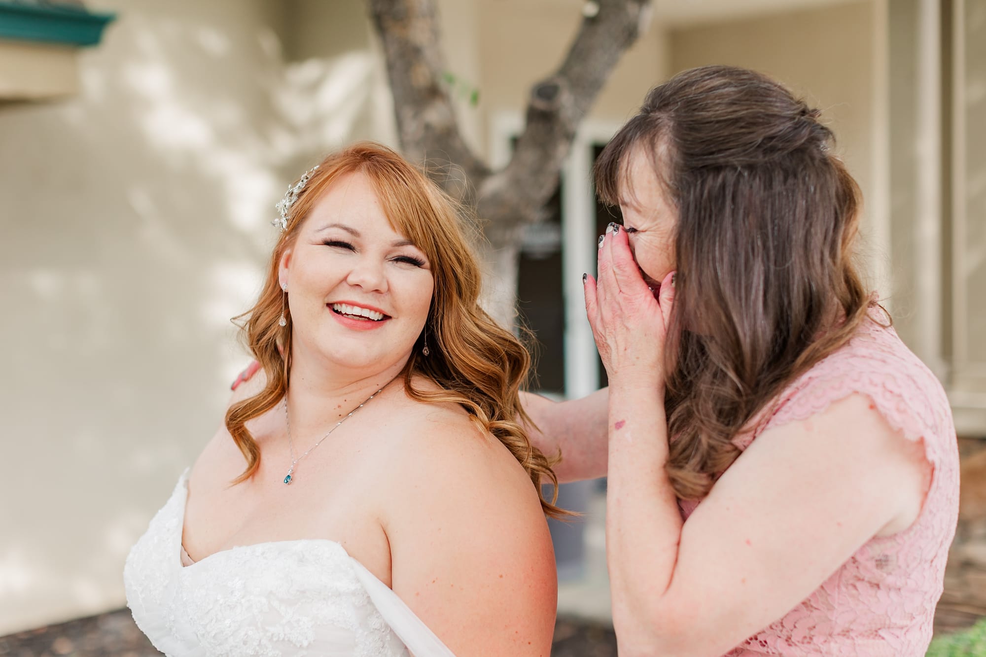 bride getting ready photos of mom zipping up dress