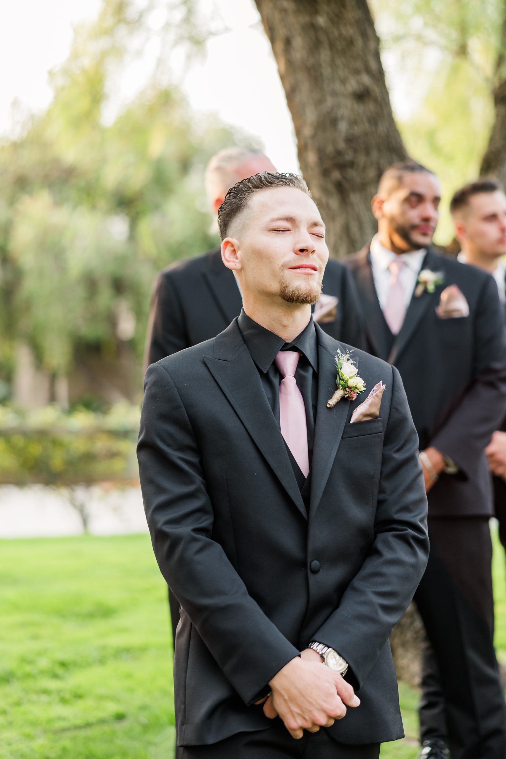 groom crying as he sees bride walking down aisle