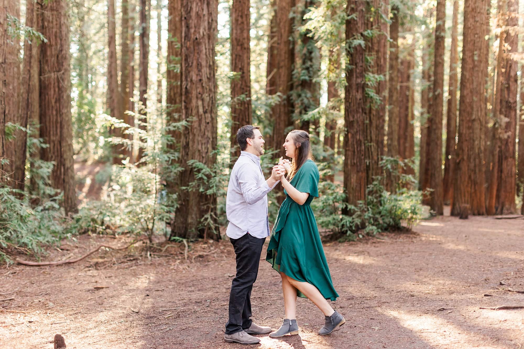 couple dancing in the redwoods of joaquin miller park