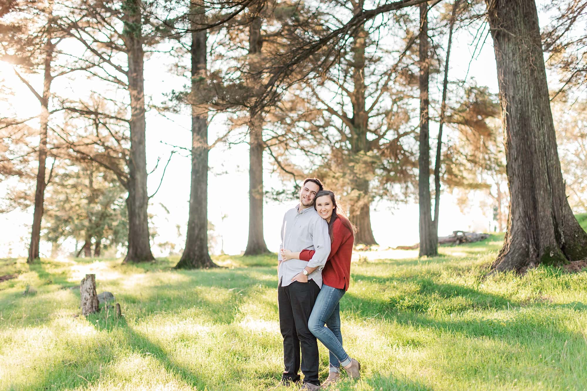 girl hugging guy from behind pose at engagement photos