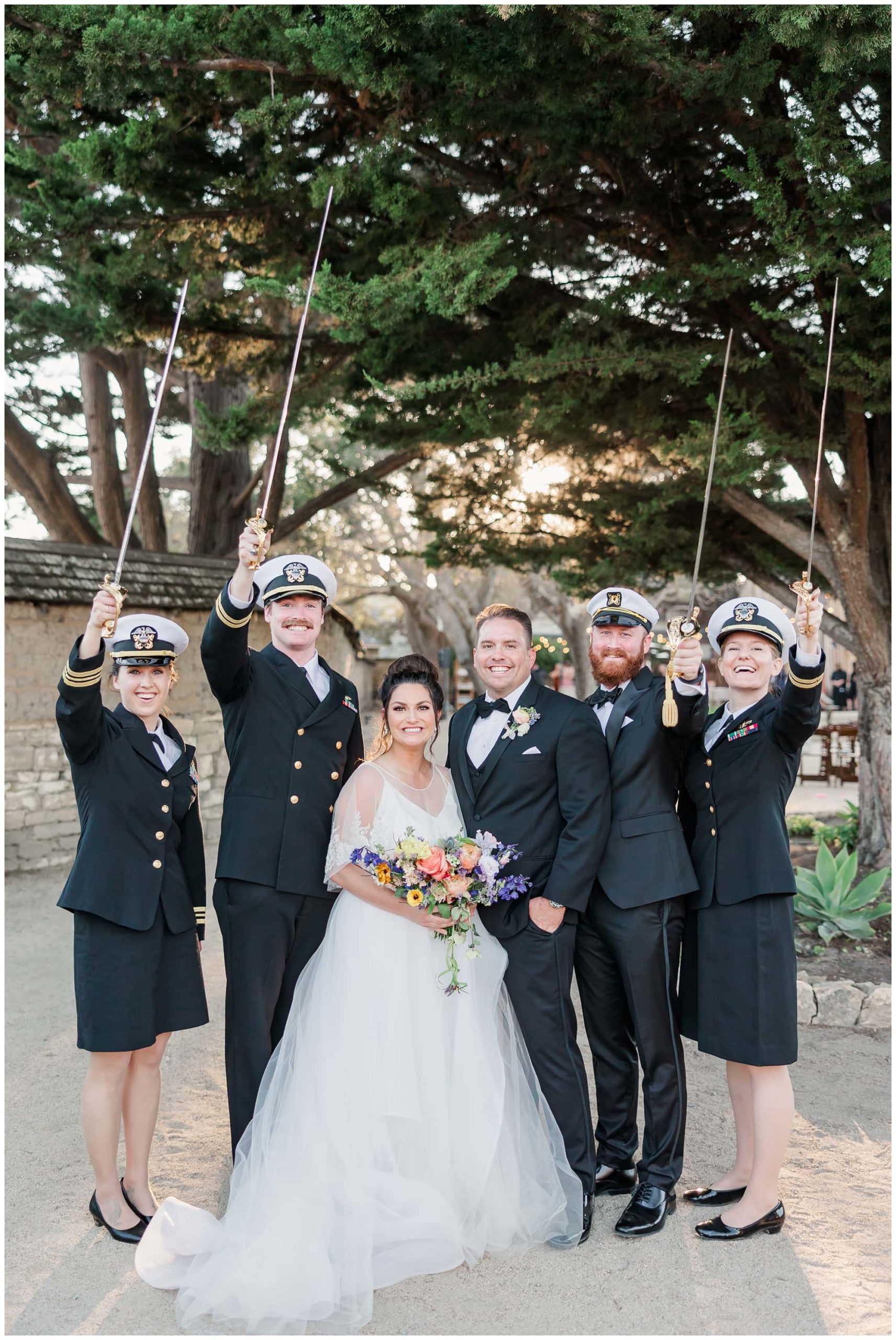 bride and groom with navy friends 