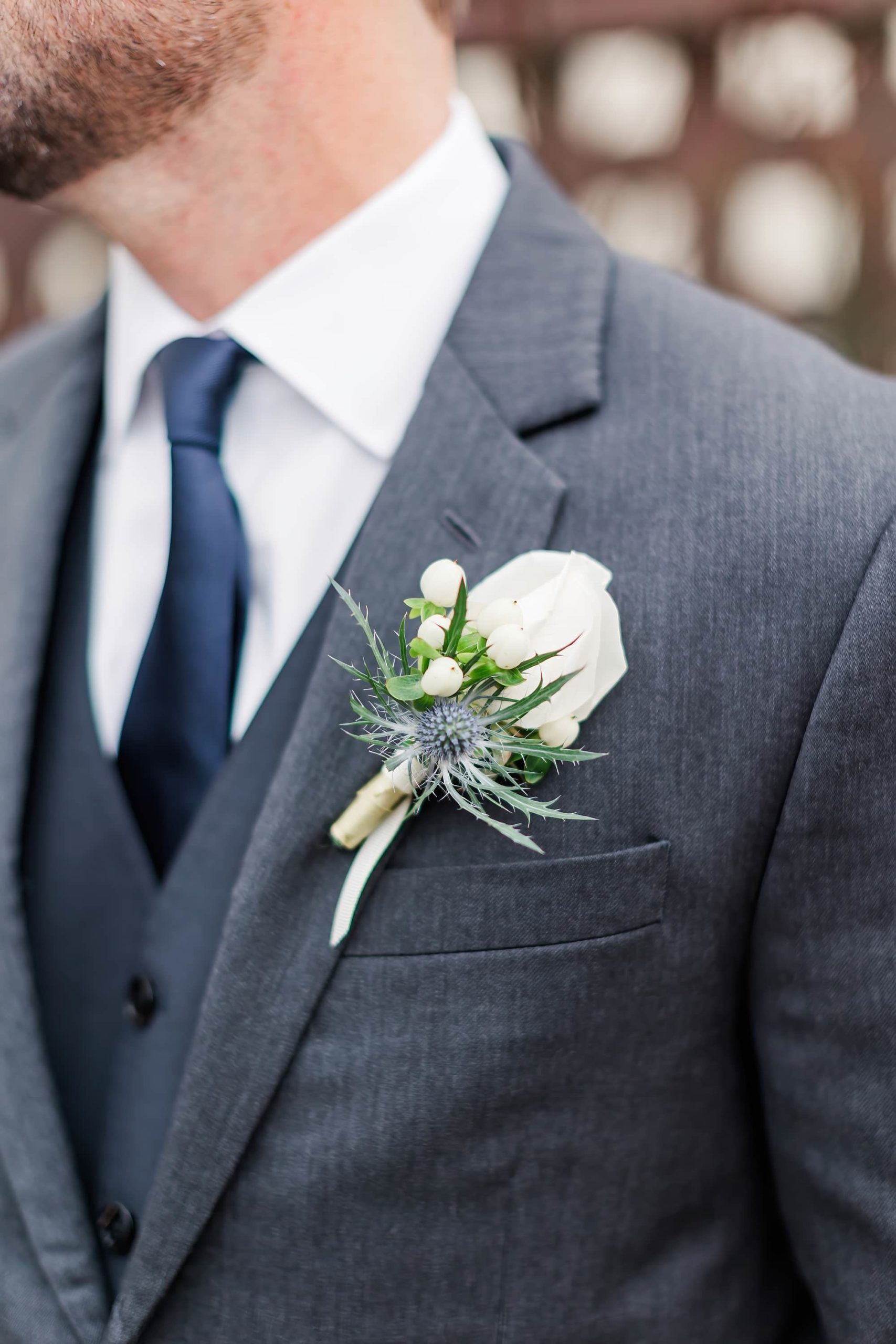 groom boutonniere detail photo 