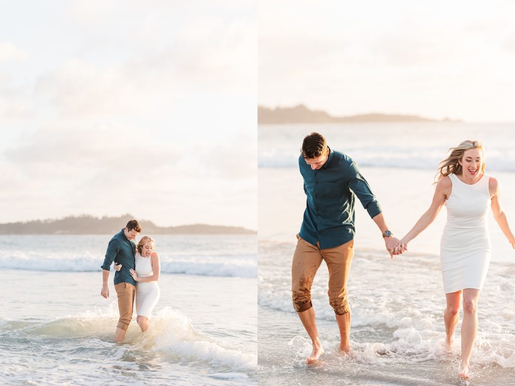 couple playing in ocean for photos