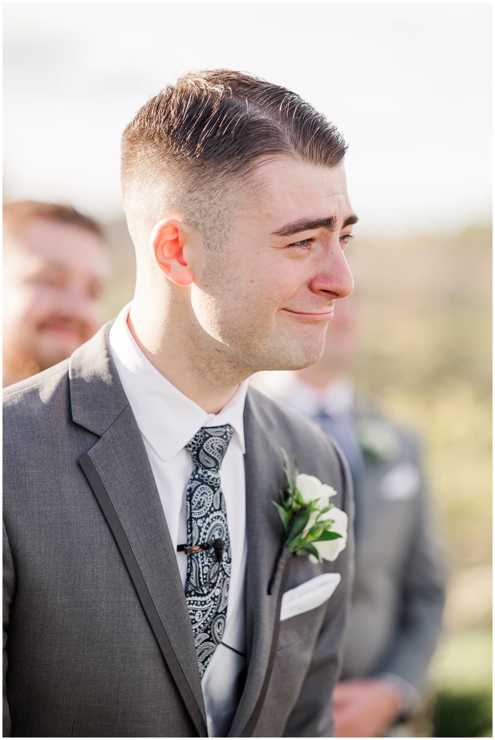 groom crying as he sees bride for the first time in wedding dress