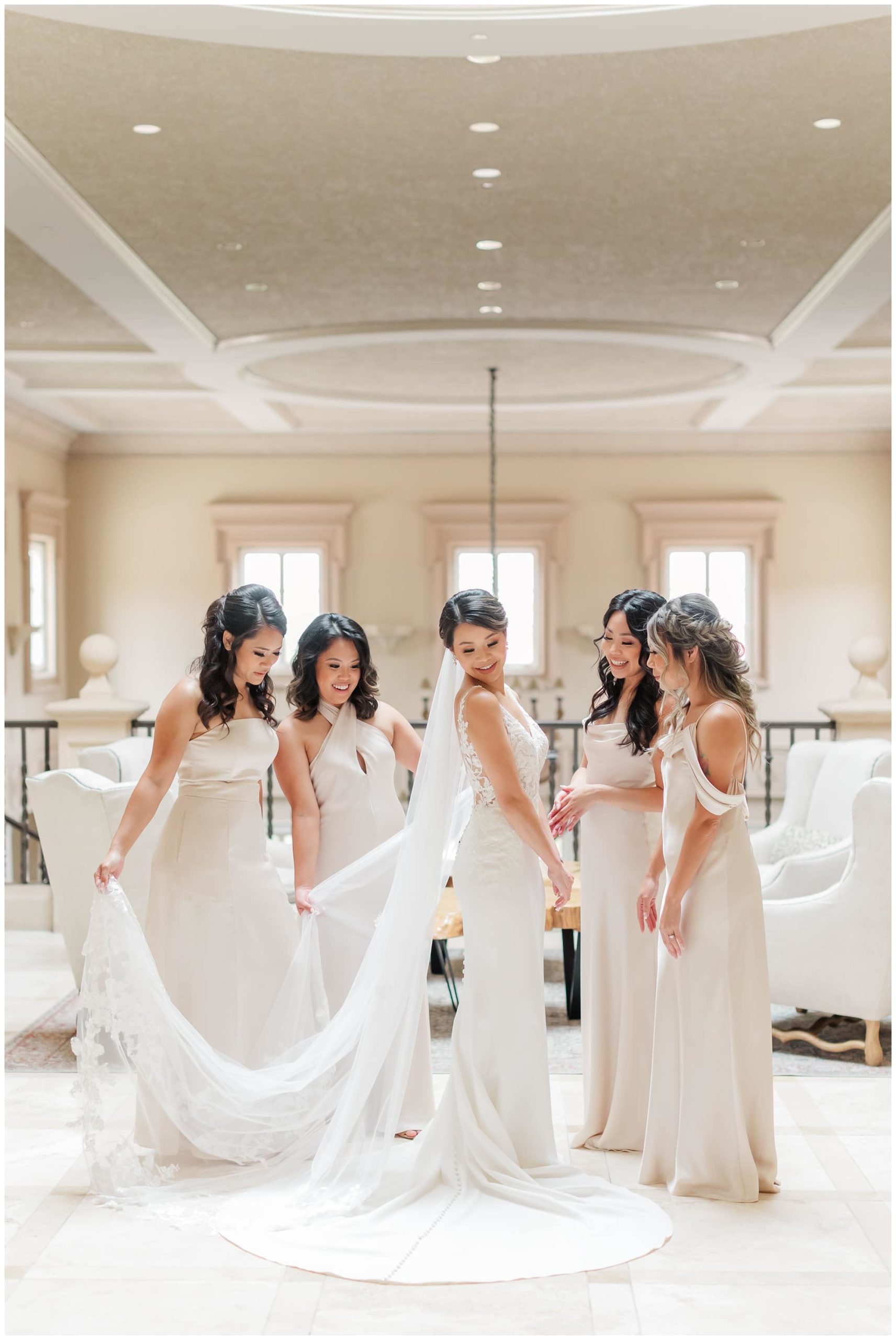 bride with bridesmaids getting ready portraits
