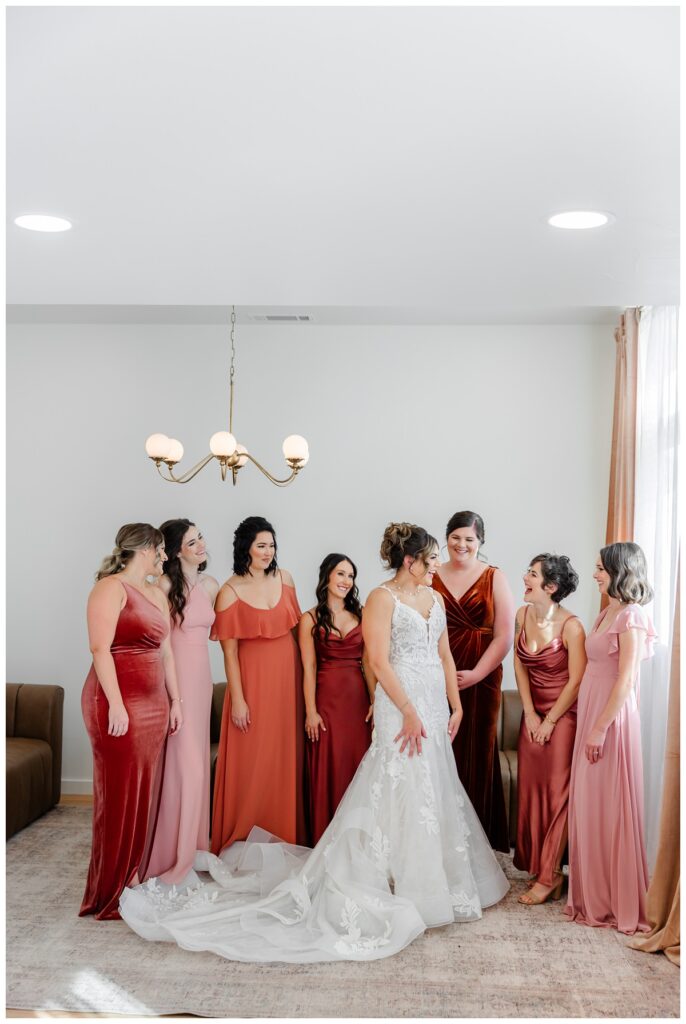 bride getting in dress